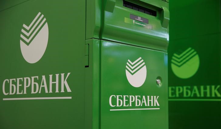 FILE PHOTO: Logos of Sberbank are seen on ATM machines at its branch in Moscow