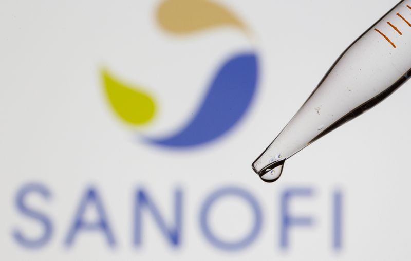 FILE PHOTO: A test tube is seen in front of a displayed Sanofi logo in this illustration