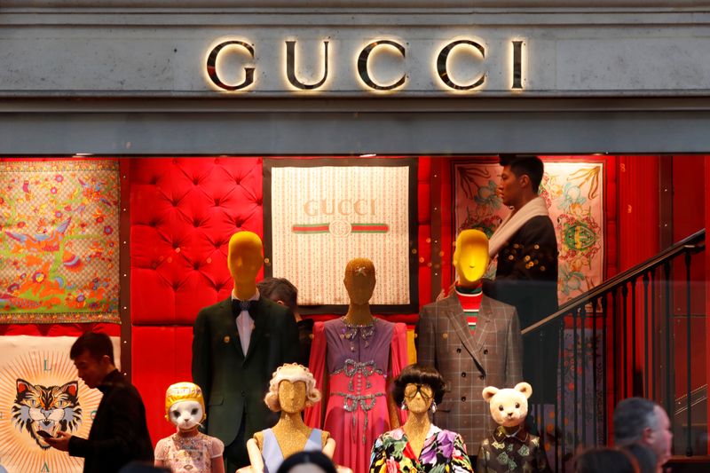 A Gucci sign is seen outside a shop in Paris