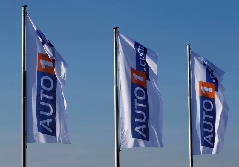 FILE PHOTO: Flags bearing the AUTO1 logo pictured at the company grounds in Zoerbig, Germany