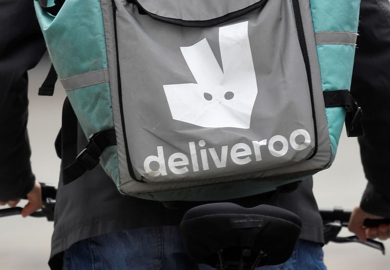 FILE PHOTO: FILE PHOTO: A Deliveroo delivery rider cycles in London, Britain