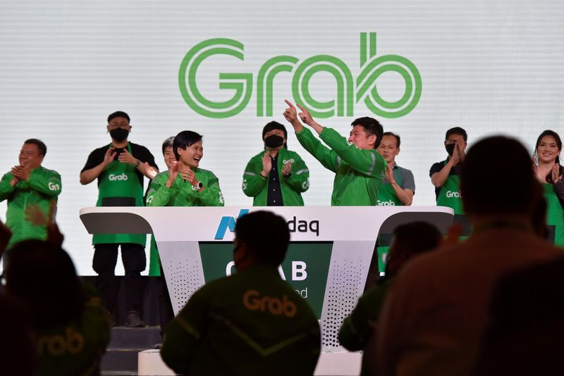Grab's CEO Anthony Tan and co-founder Tan Hooi Ling at the Grab Bell Ringing Ceremony at a hotel in Singapore