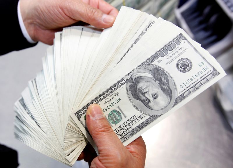 FILE PHOTO: U.S. $100 notes are shown at the Korea Exchange Bank headquarters