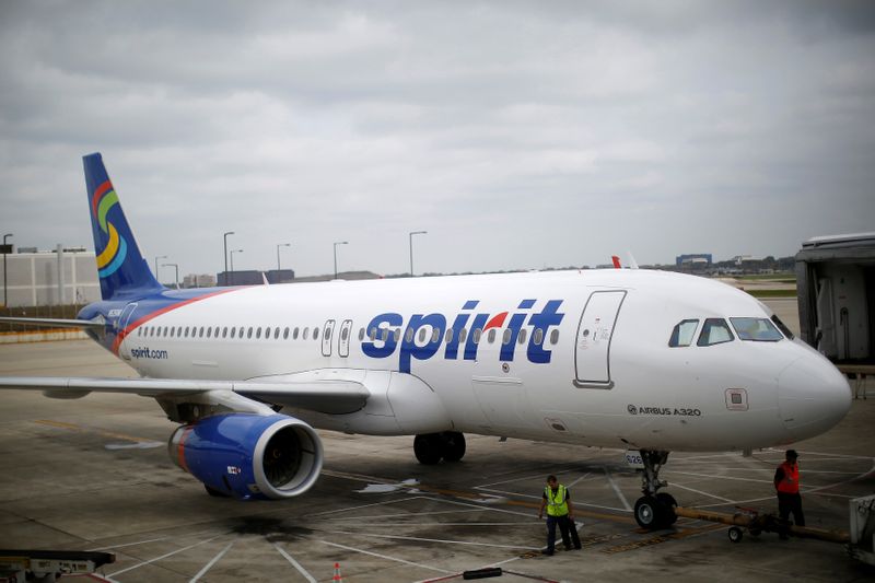FILE PHOTO: A Spirit Airlines A320-200 airplane sits at a gate at the O'Hare Airport in Chicago, Illinois
