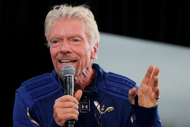 FILE PHOTO: Billionaire entrepreneur Richard Branson wears his astronaut's wings at a news conference at Spaceport America