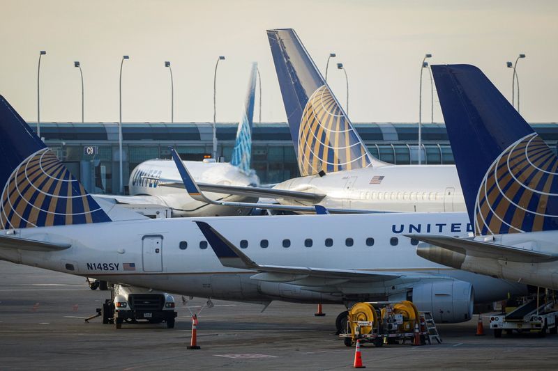 FILE PHOTO: United Airlines planes are parked at their gates at O'Hare International Airport ahead of the Thanksgiving holiday in Chicago, Illinois