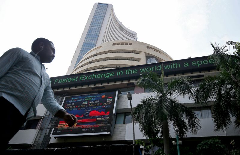 A man walks past the Bombay Stock Exchange (BSE) building in Mumbai