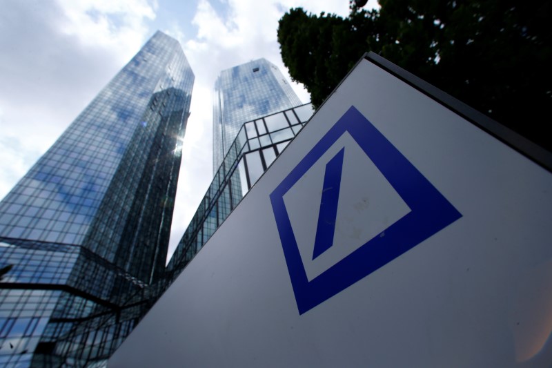 FILE PHOTO: A Deutsche Bank logo adorns a wall at the company's headquarters in Frankfurt