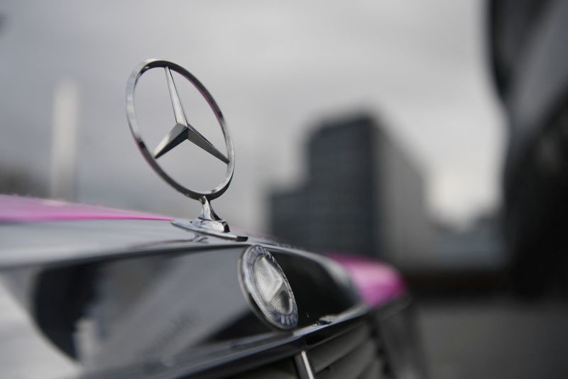 FILE PHOTO: The Mercedes-Benz logo is seen on a car in front of the Mercedes-Benz Museum in Stuttgart