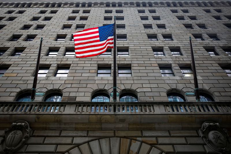 The U.S. flag flies outside The Federal Reserve Bank of New York