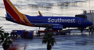 Woman sues Southwest, says airline ejected her for removing mask to drink water