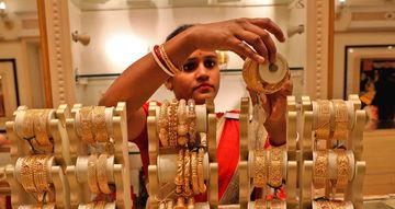 Gold prices slip as Fed affirms aggressive policy stance