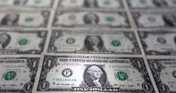 Dollar eases as traders scale back bets on Fed tightening