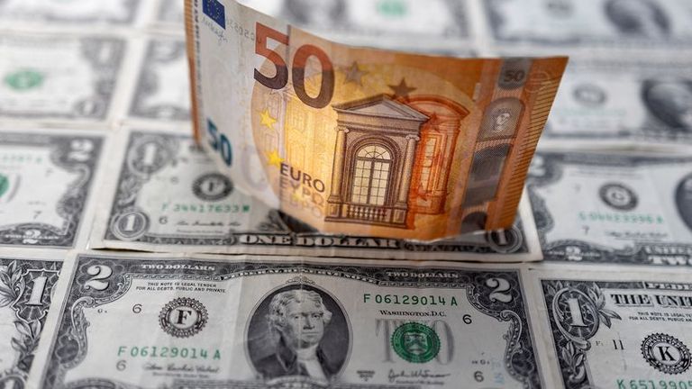Euro climbs as ECB eyes rate hikes, dollar slides