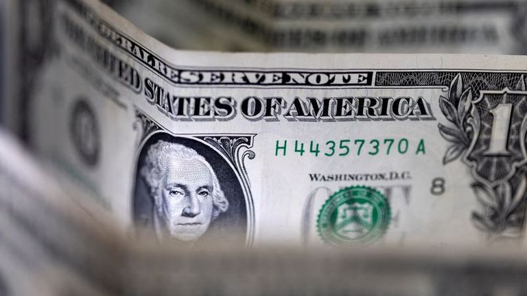 Safe haven dollar eases as risk appetite lifted by jobs data