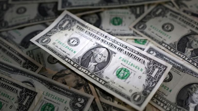 Dollar edges up as markets weigh chances of Fed rate hike