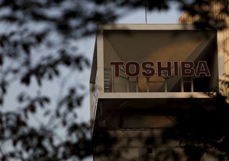 The logo of Toshiba Corp is seen behind trees at its headquarters in Tokyo