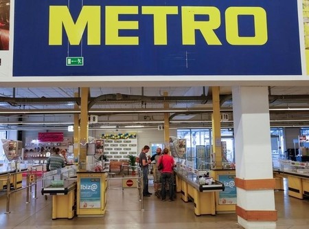 Customers are seen at cash desk of Metro cash and carry store in Kiev