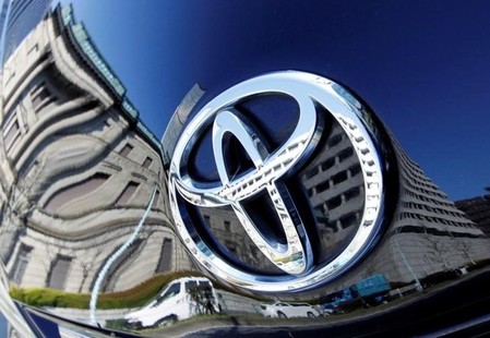 The Toyota logo on a Toyota Motor Corp's Prius hybrid car in Tokyo