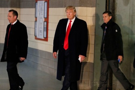 U.S. President-elect Trump leaves an elevator with Priebus and retired U.S. Army Lieutenant General Flynn before speaking with the media about meeting with families of the victims of the November 28 attacks at Ohio State University, in Columbus