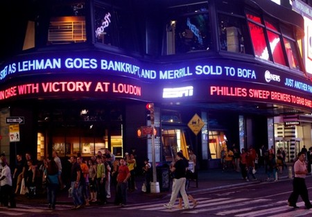 FILE PHOTO: Lehman Brothers name moves across a news ticker in New York's Times Square
