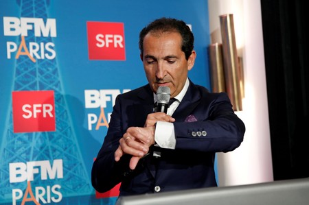 FILE PHOTO: Patrick Drahi, Franco-Israeli businessman and Executive Chairman of cable and mobile telecoms company Altice, speaks during the launch of the news channel BFM Paris