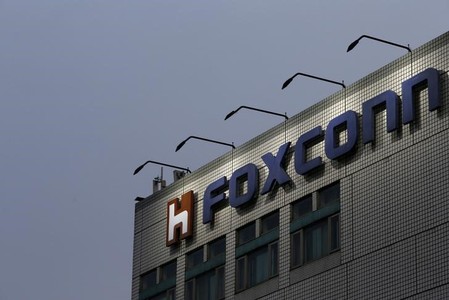 FILE PHOTO - The logo of Foxconn, the trading name of Hon Hai Precision Industry, is seen on top of the company's headquarters in New Taipei City, Taiwan