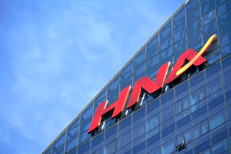 A HNA Group logo is seen on the building of HNA Plaza in Beijing