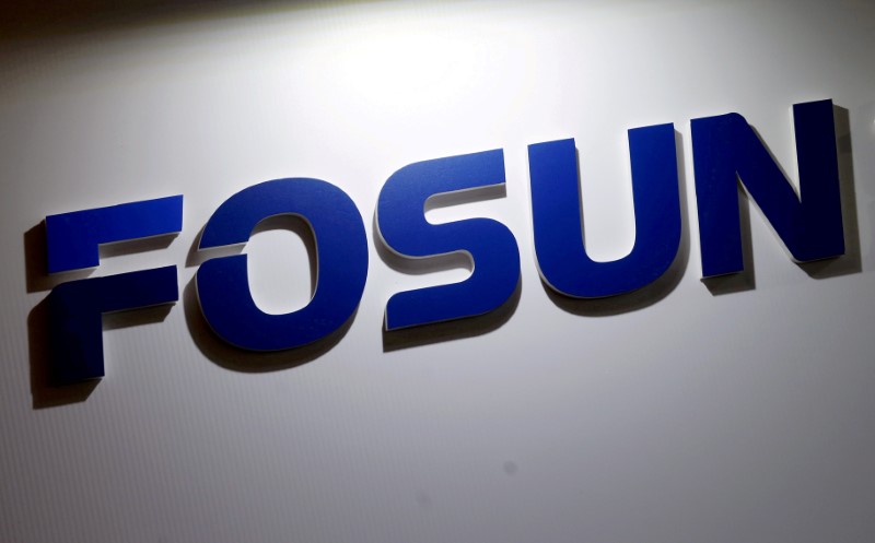 FILE PHOTO: Company logo of Fosun International is seen at the Fosun Fair held alongside the annual general meeting in Hong Kong
