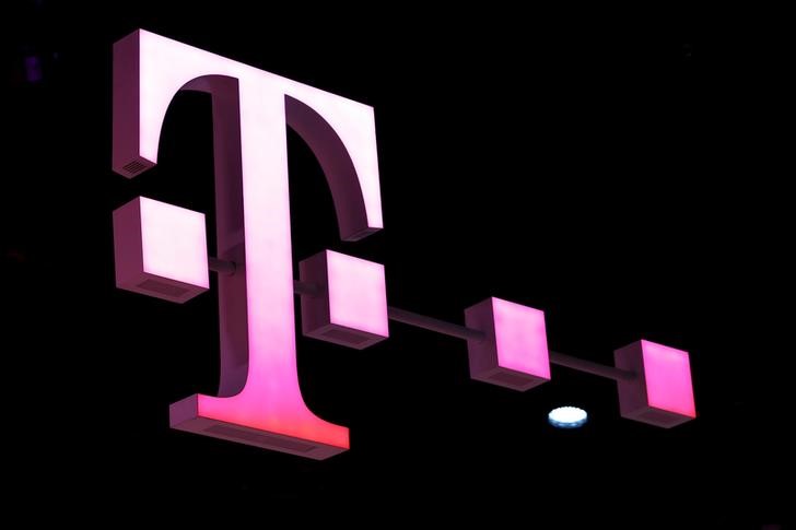 FILE PHOTO: A Deutsche Telekom logo is seen at the Mobile World Congress in Barcelona