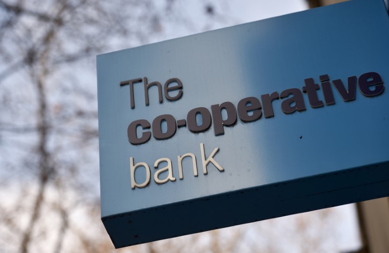 A sign hangs outside of a branch of The Co-operative Bank in London