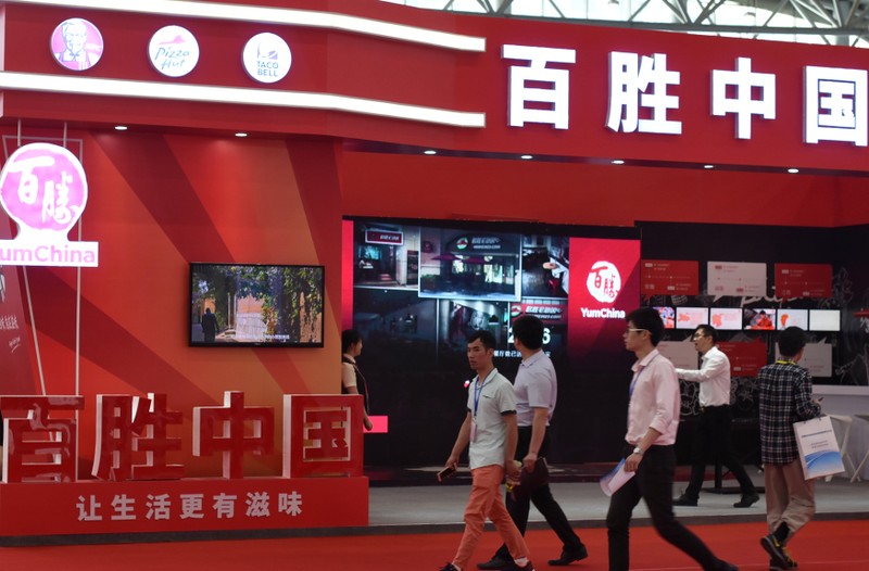 FILE PHOTO:The booth of fast food restaurant company Yum China Holdings Inc. is seen at an investment and trade fair in Hefei, Anhui