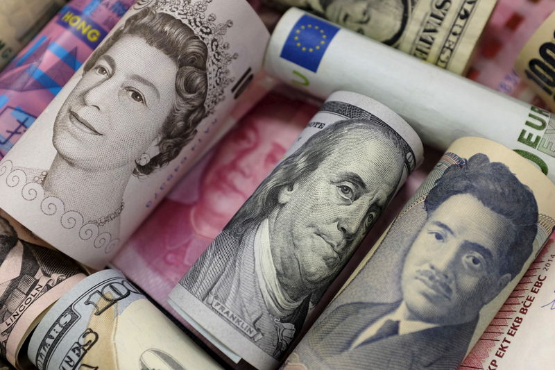 FILE PHOTO: Banknotes of Euro, Hong Kong dollar, U.S. dollar, Japanese yen, GB pound and Chinese 100 yuan are seen in this picture illustration, in Beijing