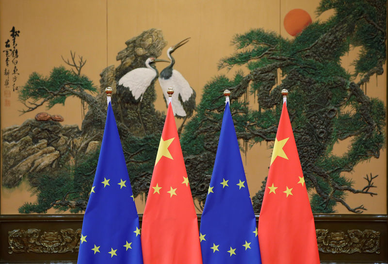 FILE PHOTO: Flags of European Union and China are pictured during the China-EU summit in Beijing