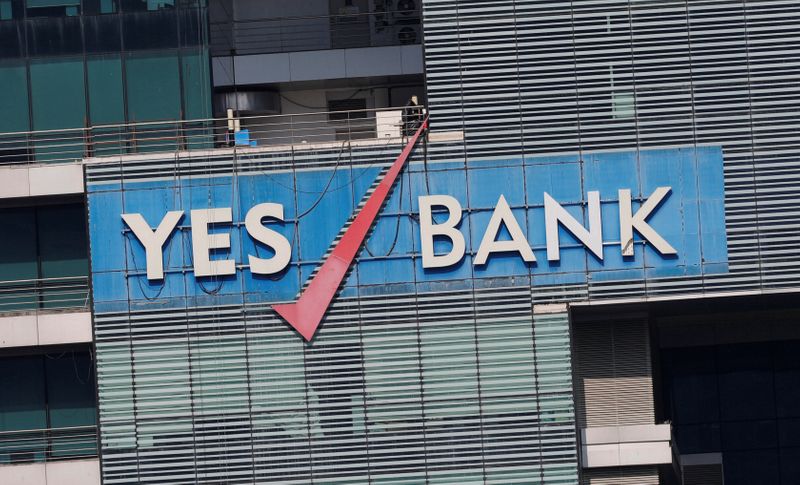 FILE PHOTO:  The logo of Yes Bank is pictured on the facade of its headquarters in Mumbai