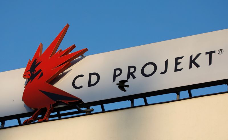 FILE PHOTO: FILE PHOTO: A bird flies in front of the CD Projekt logo at its headquarters in Warsaw
