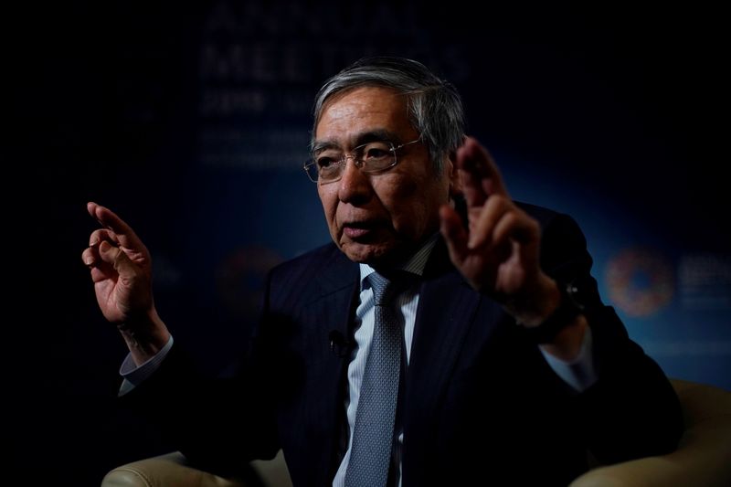 Bank of Japan (BOJ) Governor Haruhiko Kuroda, gestures as he replies a question during an interview with Reuters in Washington