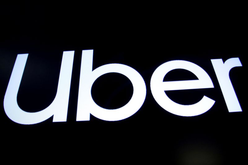 FILE PHOTO: A screen displays the company logo for Uber Technologies Inc. on the day of it's IPO at the NYSE in New York