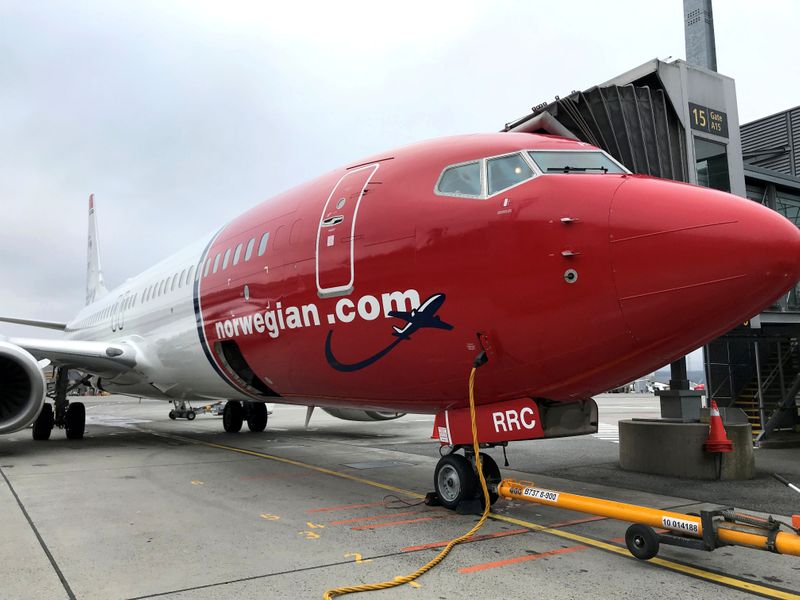 FILE PHOTO: A Norwegian Air plane is refuelled at Oslo Gardermoen airport
