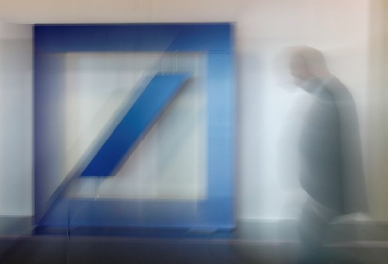 FILE PHOTO: The logo of Germany’s Deutsche Bank is on display ahead of the bank’s annual shareholder meeting in Frankfurt