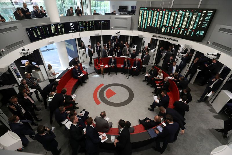 FILE PHOTO: Traders work on the floor of the London Metal Exchange
