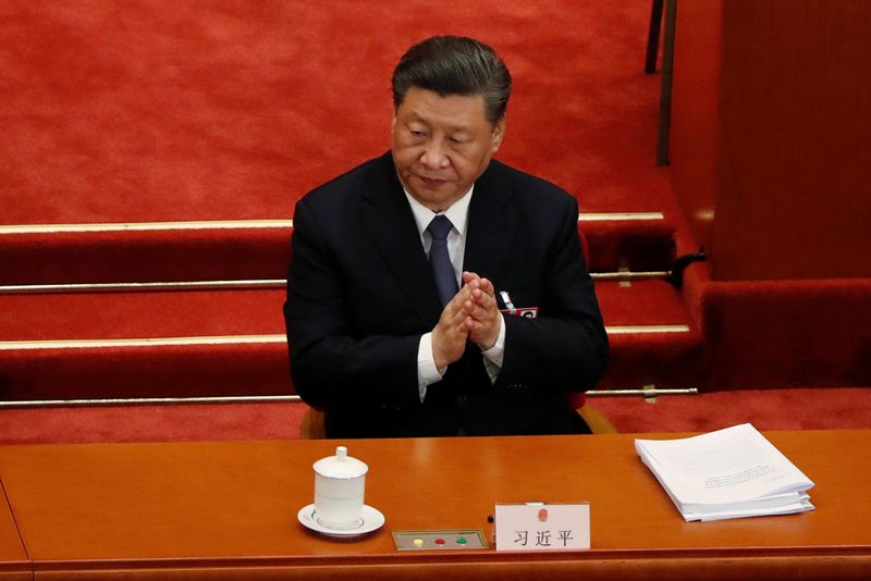 Chinese President Xi Jinping attends the opening session of NPC in Beijing