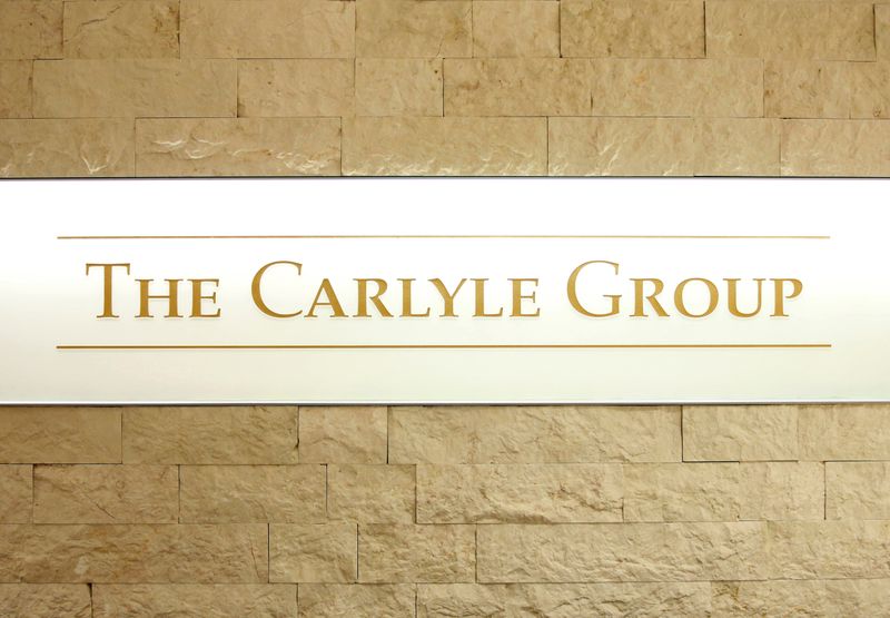 FILE PHOTO: The logo of The Carlyle Group is displayed at the company's office in Tokyo