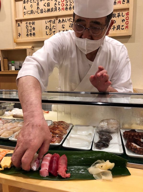 70-year-old sushi chef Seiichi Yano serves sushi at Isozushi restaurant at Toyosu Market in Tokyo