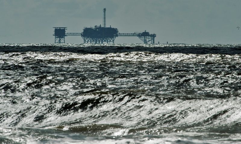 FILE PHOTO: An oil and gas drilling platform stands offshore near Dauphin Island, Alabama