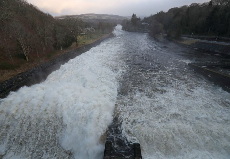 FILE PHOTO: Pitlochry Power Station releases excess capacity of water over Pitlochry Dam, part of the Tummel hydro-electric power scheme in Perthshire, Scotland