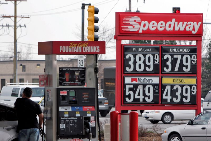 FILE PHOTO: A motorist fuels-up his car at a Speedway gas station in Des Plaines, Illinois
