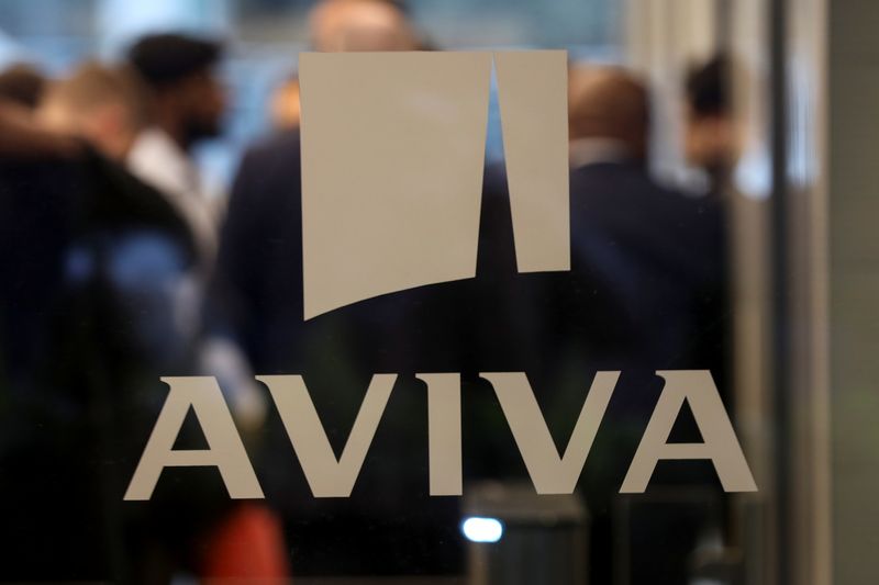 FILE PHOTO: A logo sits on the window of the Aviva head office in the city of London