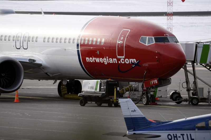 Grounded Boeing 737 Max 8 passenger plane of the Norwegian low-cost airline Norwegian is seen parked on the tarmac at Helsinki Airport in Vantaa
