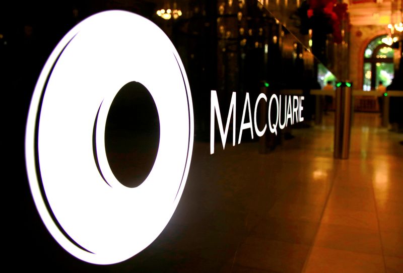 FILE PHOTO: The logo of Australia's Macquarie Group adorns a desk in the reception area of its Sydney office headquarters
